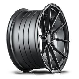 ABS Wheels F35 Grå aluminiumfälg monterade på bil i stämnigsfull miljö