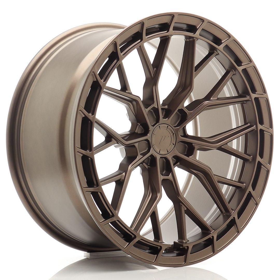 JR Wheels JR48 Bronse aluminiumsfelger montert på bil i en stemningsfull omgivelse