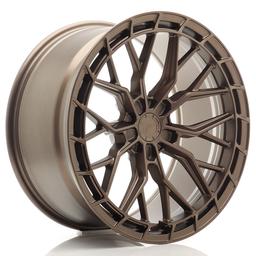 JR Wheels JR48 Bronse aluminiumsfelger montert på bil i en stemningsfull omgivelse