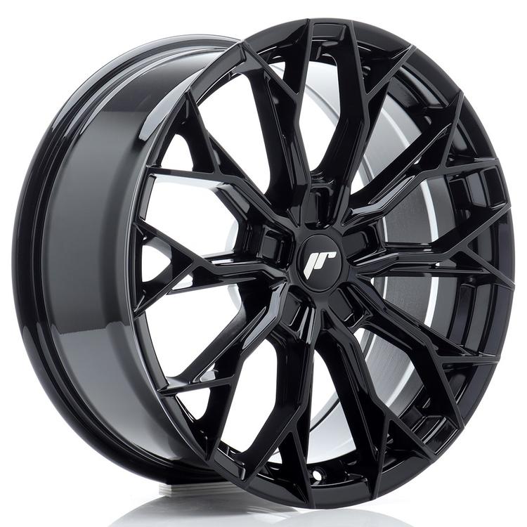 JR Wheels JR49 Black alloy wheel mounted on car in an atmospheric setting