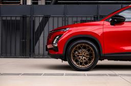 JR Wheels JR49 Bronze alloy wheel mounted on car in an atmospheric setting