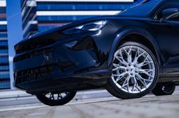 JR Wheels JR49 Silver alloy wheel mounted on car in an atmospheric setting