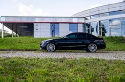 JR Wheels JR49 Silver alloy wheel mounted on car in an atmospheric setting