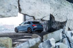 JR Wheels JR50 Bronze alloy wheel mounted on car in an atmospheric setting