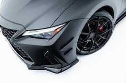 JR Wheels JR50 Black alloy wheel mounted on car in an atmospheric setting