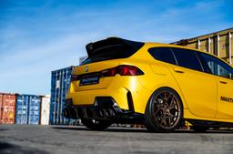 JR Wheels JR51 Bronze alloy wheel mounted on car in an atmospheric setting