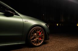 JR Wheels JR51 Bronze alloy wheel mounted on car in an atmospheric setting