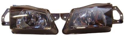 TYC ORIG. MAZDA 323 98- 4 DOOR BLACK HEADLIGHTS - PAIR