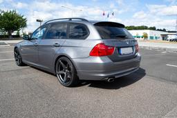 Imaz Wheels IM14 Grey alloy wheel mounted on car in an atmospheric setting