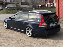Imaz Wheels IM14 Silver alloy wheel mounted on car in an atmospheric setting