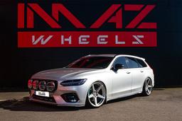 Imaz Wheels IM14 Silver alloy wheel mounted on car in an atmospheric setting