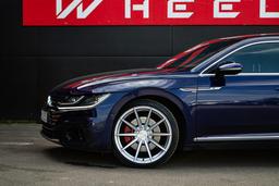 Imaz Wheels FF499 Silver alloy wheel mounted on car in an atmospheric setting