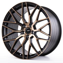ABS Wheels F8 Bronze alloy wheel mounted on car in an atmospheric setting
