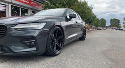 Imaz Wheels IM14 Black alloy wheel mounted on car in an atmospheric setting