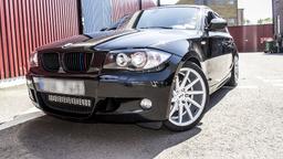 Imaz Wheels IM5R Silver alloy wheel mounted on car in an atmospheric setting