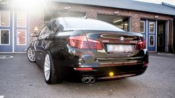 Imaz Wheels IM5R Silver alloy wheel mounted on car in an atmospheric setting