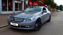 Imaz Wheels IM5R Grey alloy wheel mounted on car in an atmospheric setting