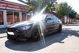 Imaz Wheels FF517 Black alloy wheel mounted on car in an atmospheric setting