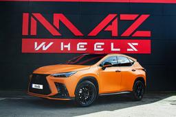 Imaz Wheels FF2 Black alloy wheel mounted on car in an atmospheric setting