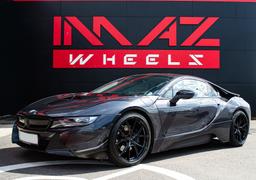 Imaz Wheels FF593 Black alloy wheel mounted on car in an atmospheric setting