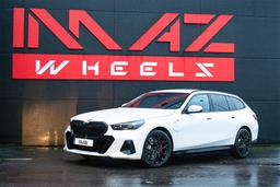 Imaz Wheels FF90 Black alloy wheel mounted on car in an atmospheric setting