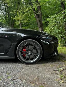 Imaz Wheels FF2 Grey alloy wheel mounted on car in an atmospheric setting