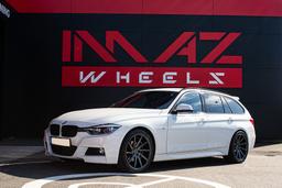 Imaz Wheels IM5L Grå aluminiumsfelger montert på bil i en stemningsfull omgivelse