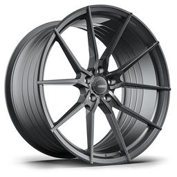 ABS Wheels F15 Grey alloy wheel mounted on car in an atmospheric setting