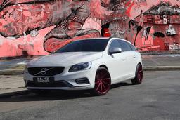 Imaz Wheels IM5L Red alloy wheel mounted on car in an atmospheric setting