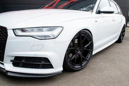 Imaz Wheels FF2 Black alloy wheel mounted on car in an atmospheric setting