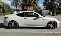 Imaz Wheels IM5R Black alloy wheel mounted on car in an atmospheric setting