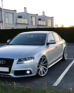 Imaz Wheels IM5R Silver alloy wheel mounted on car in an atmospheric setting