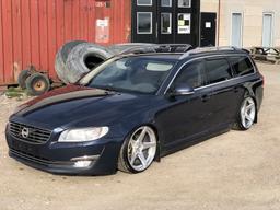Imaz Wheels IM14 Silver alloy wheel mounted on car in an atmospheric setting