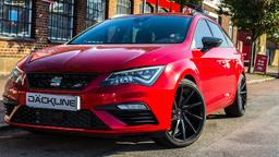 Imaz Wheels IM5R Black alloy wheel mounted on car in an atmospheric setting