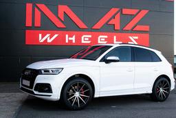 Imaz Wheels FF499 Black alloy wheel mounted on car in an atmospheric setting