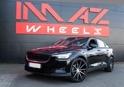 Imaz Wheels FF499 Black alloy wheel mounted on car in an atmospheric setting