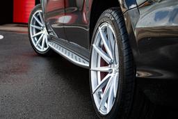 Imaz Wheels FF499 Silver alloy wheel mounted on car in an atmospheric setting