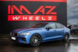 Imaz Wheels FF499 Black alloy wheel mounted on car in an atmospheric setting
