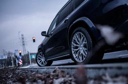 Concaver CVR1 Silver alloy wheel mounted on car in an atmospheric setting