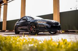 Concaver CVR1 Black alloy wheel mounted on car in an atmospheric setting