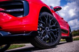 Concaver CVR1 Black alloy wheel mounted on car in an atmospheric setting
