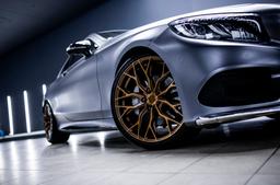 Concaver CVR1 Bronze alloy wheel mounted on car in an atmospheric setting