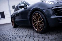 Concaver CVR1 Bronze alloy wheel mounted on car in an atmospheric setting