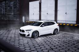 Concaver CVR2 Silver alloy wheel mounted on car in an atmospheric setting