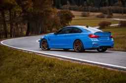 Concaver CVR2 Bronze alloy wheel mounted on car in an atmospheric setting
