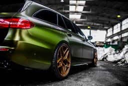 Concaver CVR2 Bronze alloy wheel mounted on car in an atmospheric setting