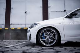 Concaver CVR2 Silver alloy wheel mounted on car in an atmospheric setting