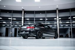 Concaver CVR2 Black alloy wheel mounted on car in an atmospheric setting