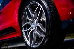 Concaver CVR3 Silver alloy wheel mounted on car in an atmospheric setting