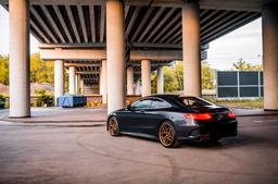 Concaver CVR3 Bronze alloy wheel mounted on car in an atmospheric setting